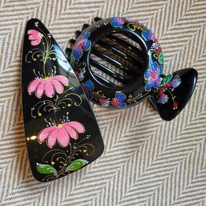 Two painted black hair clips